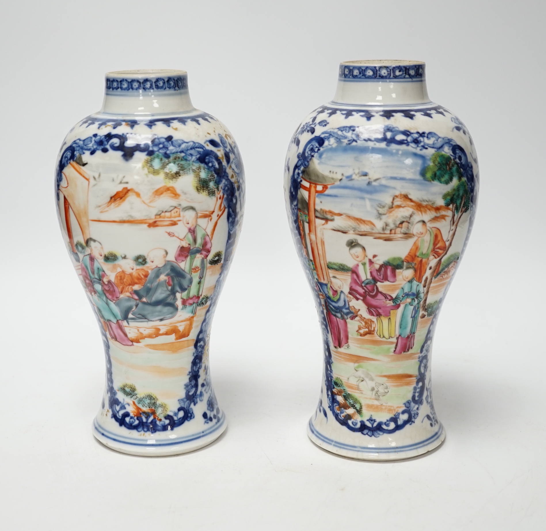 A pair of late 18th century Chinese famille rose ‘mandarin’ vases, 19cm high